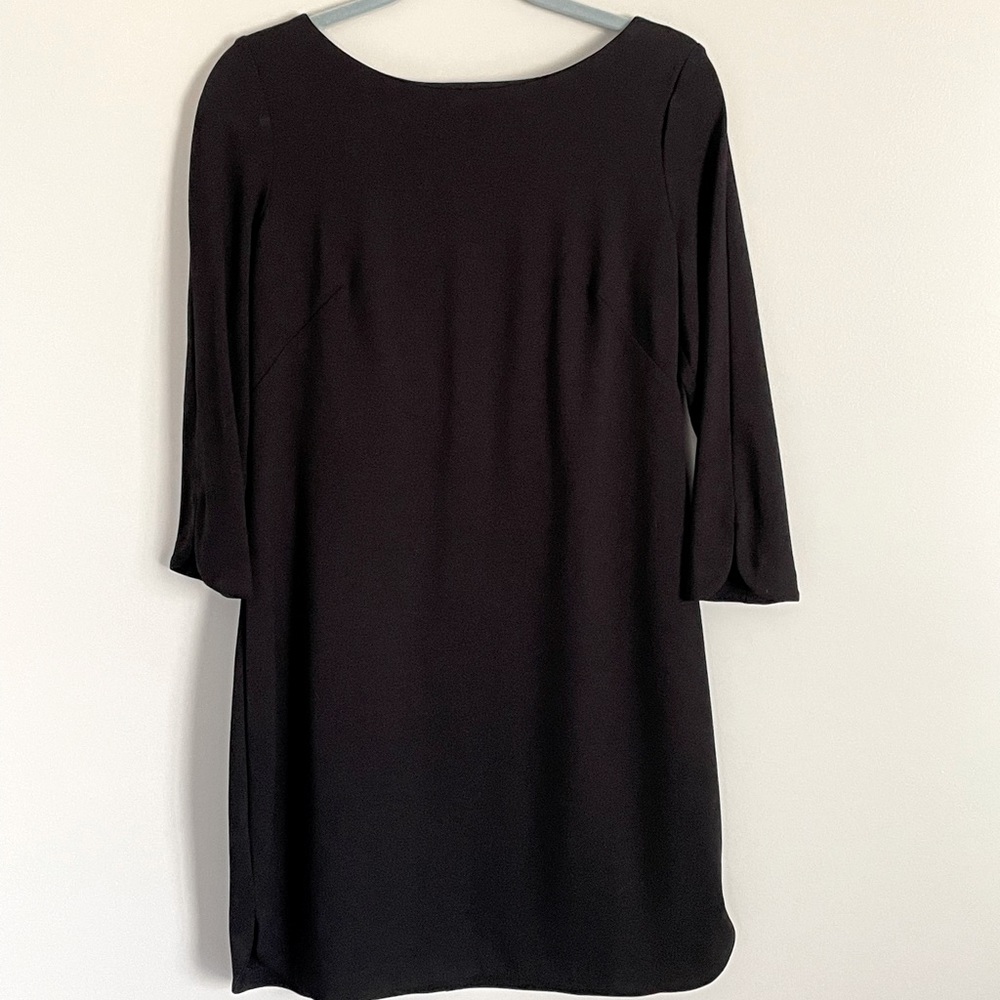 Vince Camuto size 8 black shift dress. 3/4 length sleeves. Silver zipper back.